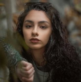 shallow focus photo of woman in black jacket